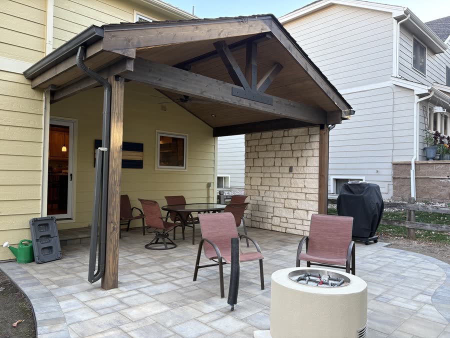 Paver patio and fire bowl under a timber pavilion
