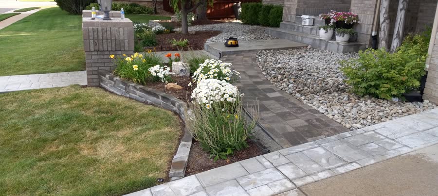 Paver garden path with river rock and stone edging