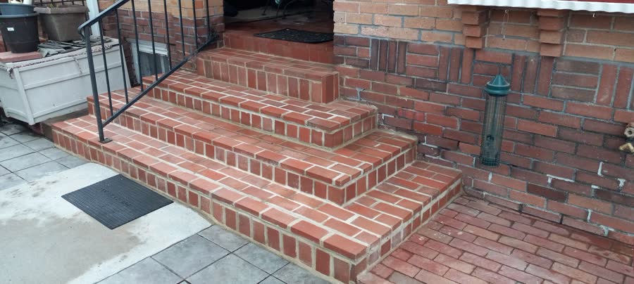 Wide red brick steps and landing