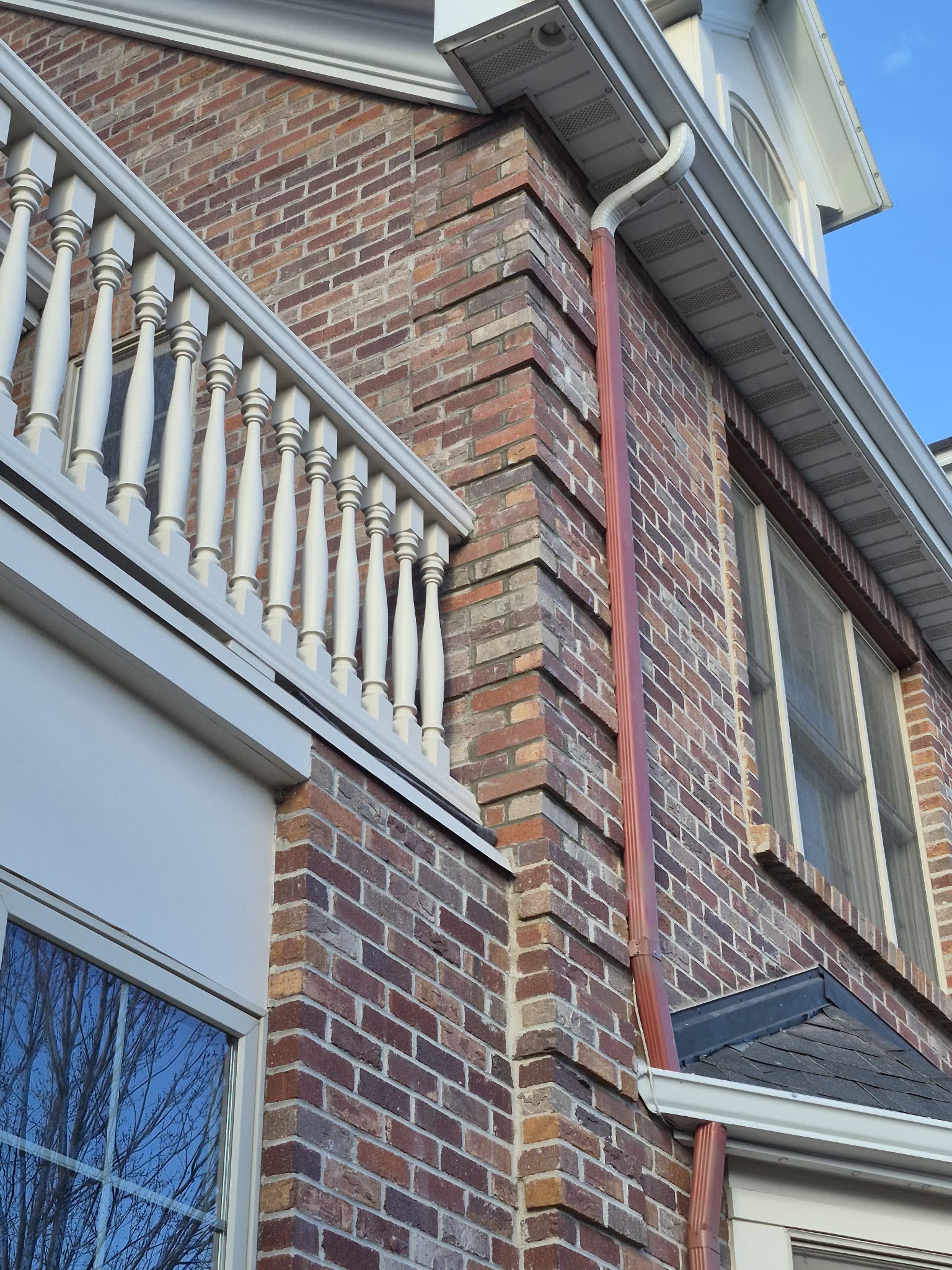 Red brick facade and balcony corner
